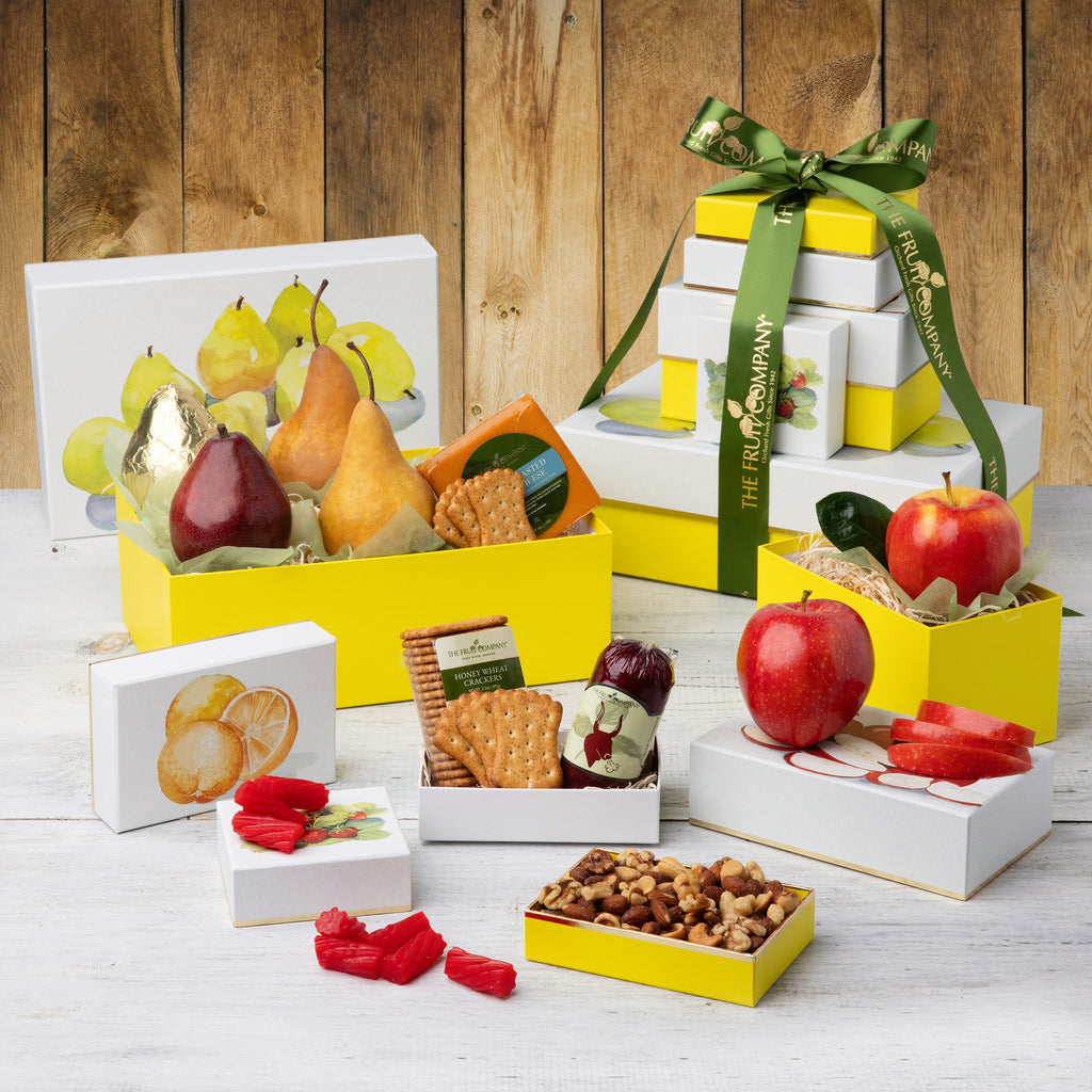 5 Reusable watercolor boxes filled with apples, pears, crackers, and licorice
