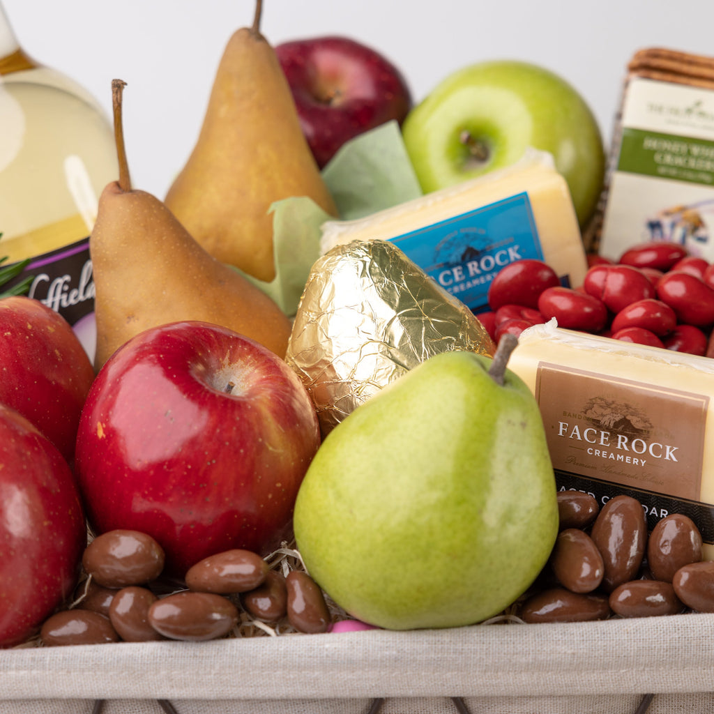 Shiny chocolate covered nuts, ripe apples and pears