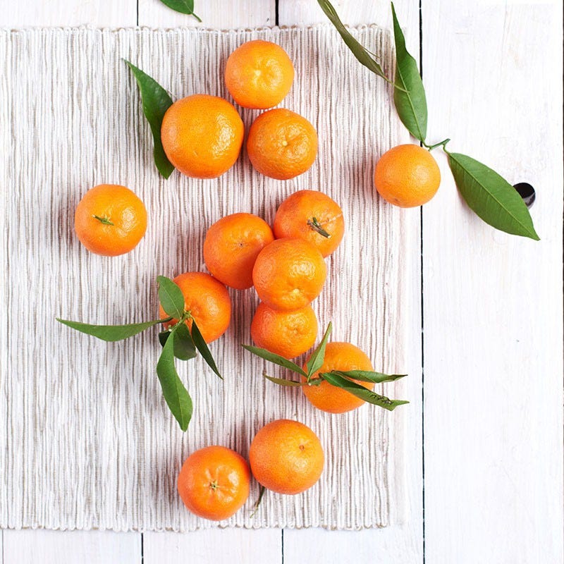 Mandarin Oranges scattered on white background