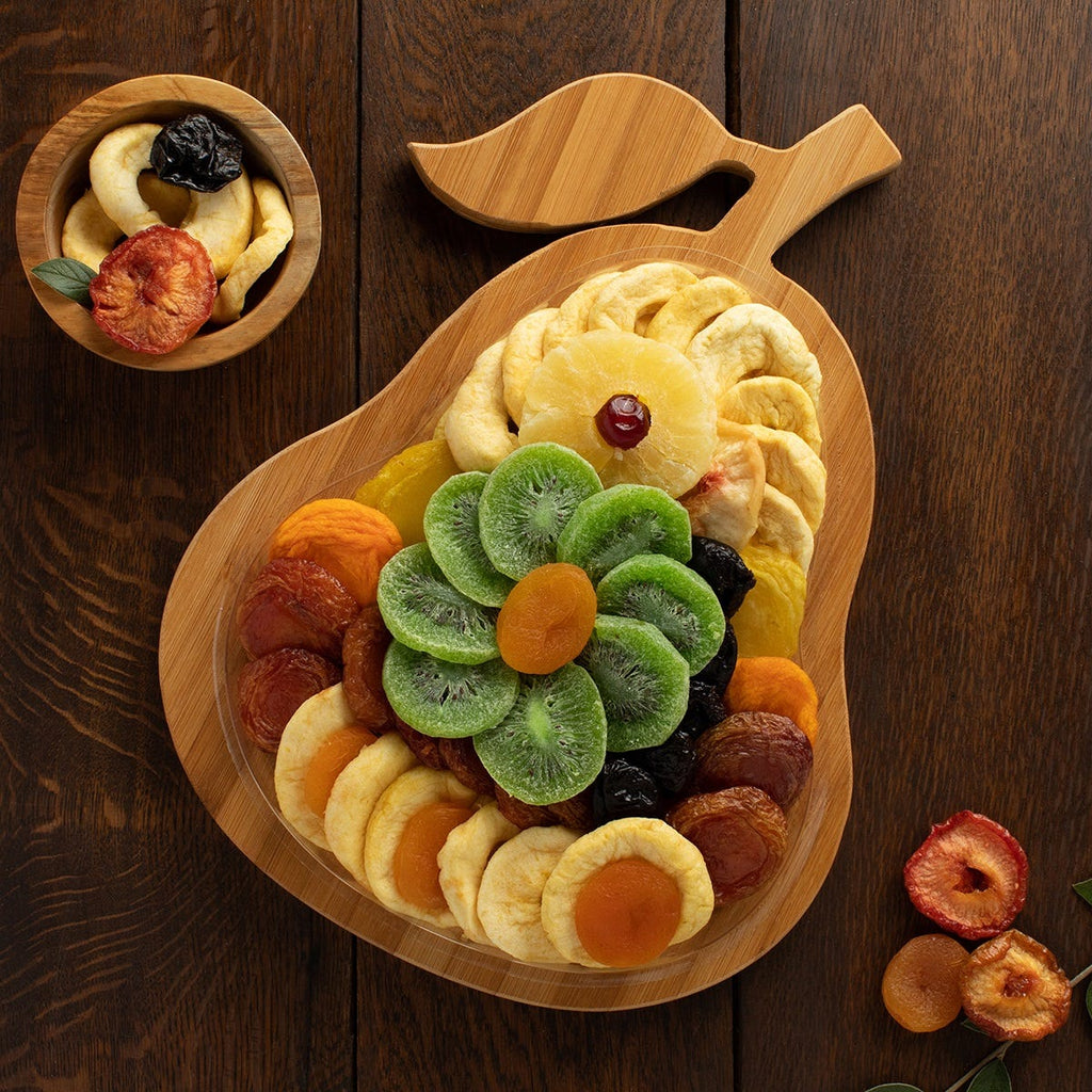 9 types of dried fruits arranged on an included pear-shaped bamboo tray 